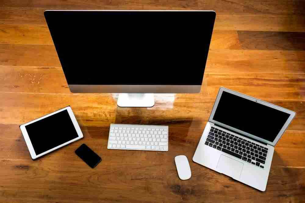 computer-laptop-tablet-view-from-wooden-table | MacSolutions Plus Buffalo's local Apple Authorized Service Center